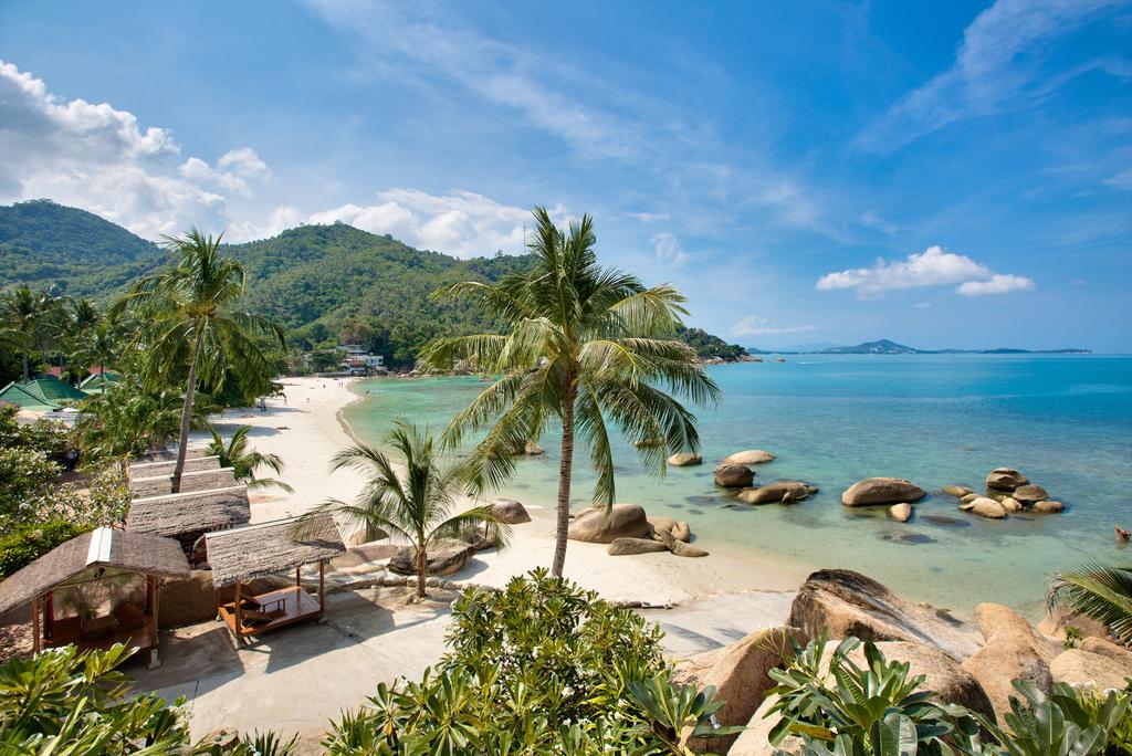 Koh Samui beach with rocks and palm tree